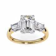 emerald solitaire with baguette three stone engagement ring