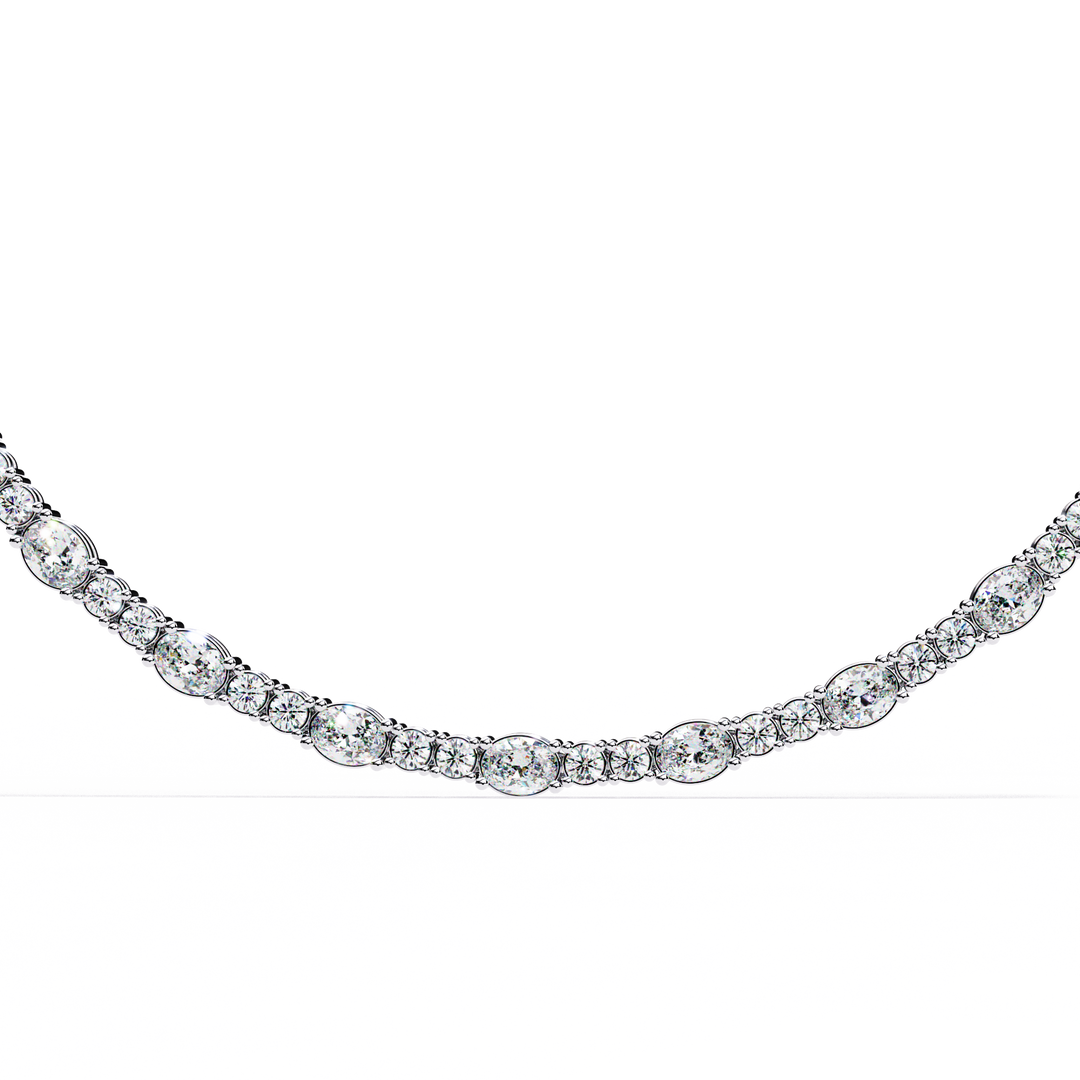Discover our luxurious 18K Gold Lab-Grown Diamond Tennis Necklace featuring 10.61 carats of Oval and Brilliant Round Cut diamonds. Ethically crafted with exceptional brilliance for timeless elegance.