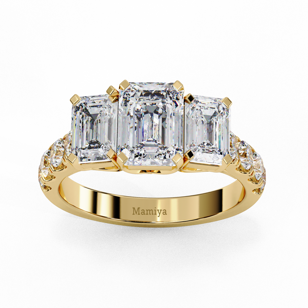 Three stone emerald cut engagement ring