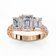 Three stone emerald cut engagement ring