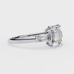 Load and play video in Gallery viewer, emerald solitaire with baguette three stone engagement ring